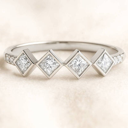 ring with square-cut diamonds on a light background