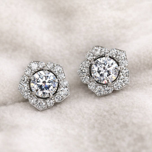 Pair of diamond earrings on a light background