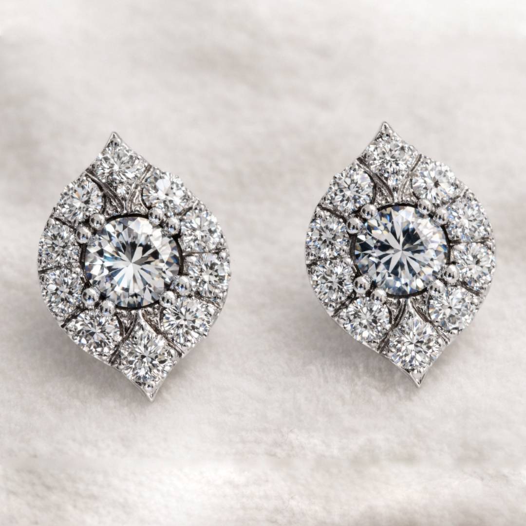 Pair of diamond earrings on a light background