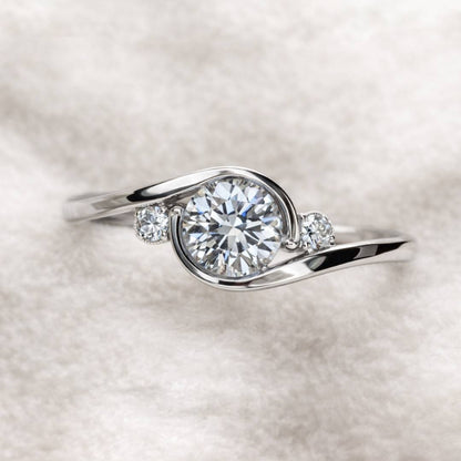 ring with a diamond on a soft white background