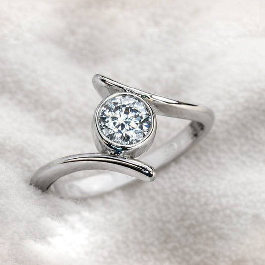 ring with a diamond on a light gray background