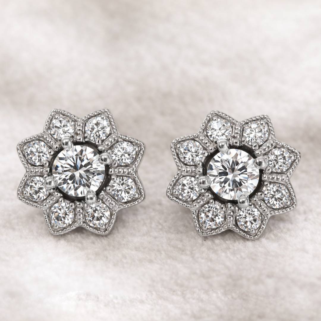 Pair of diamond earrings on a light background