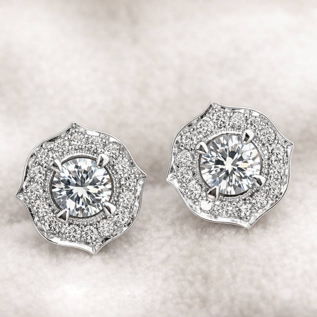Pair of diamond earrings on a light background