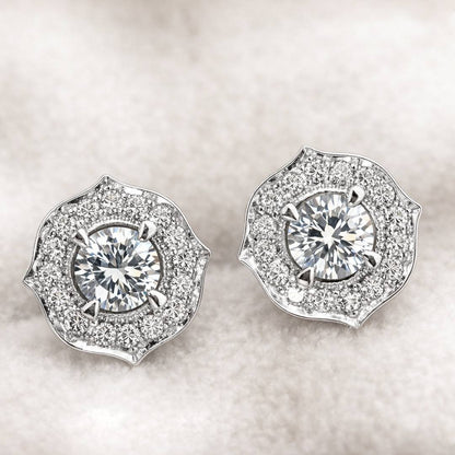 Pair of diamond earrings on a light background