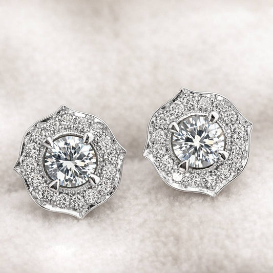 Pair of diamond earrings on a light background