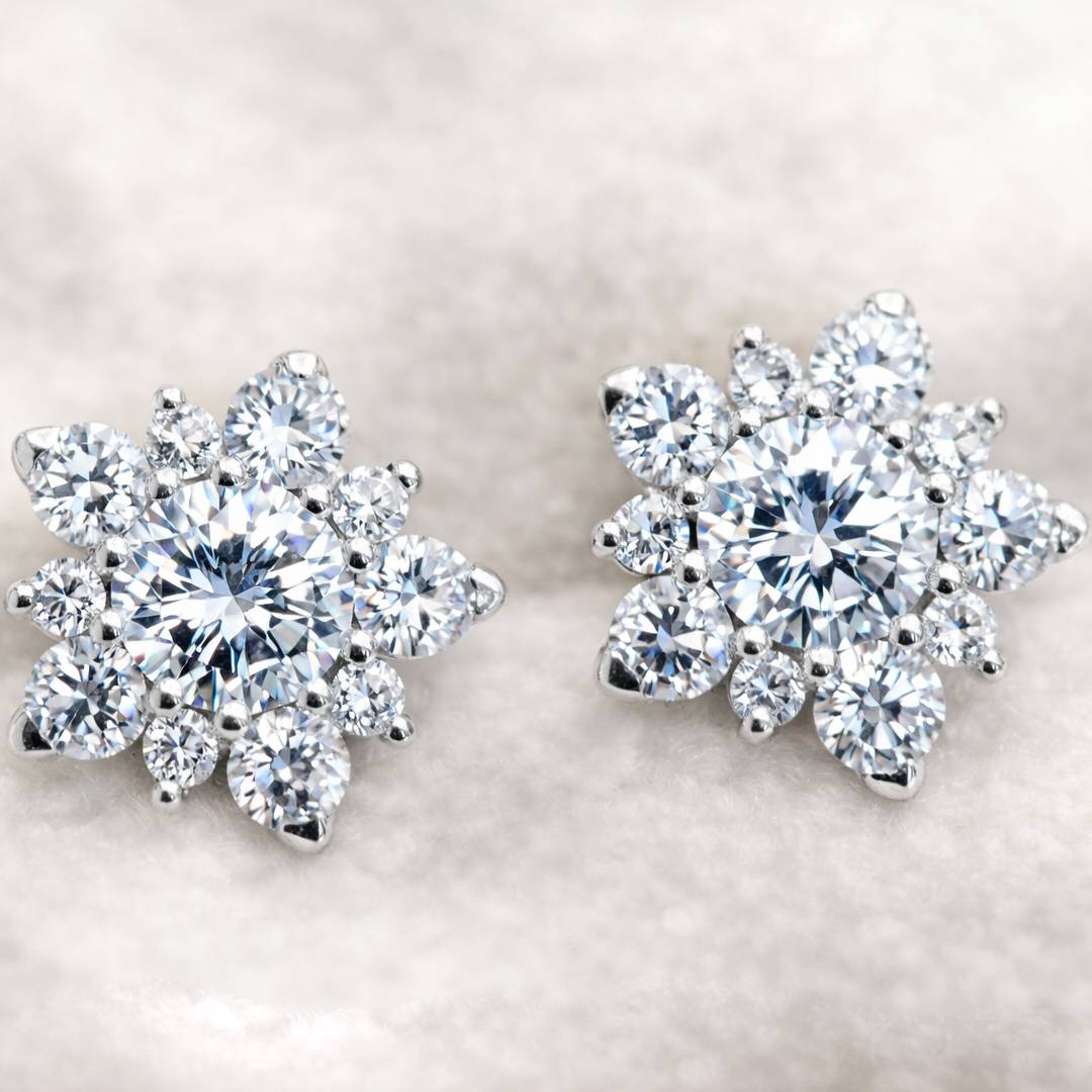 Pair of diamond earrings on a light background