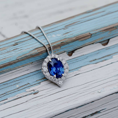 Blue gemstone necklace on a rustic wooden surface