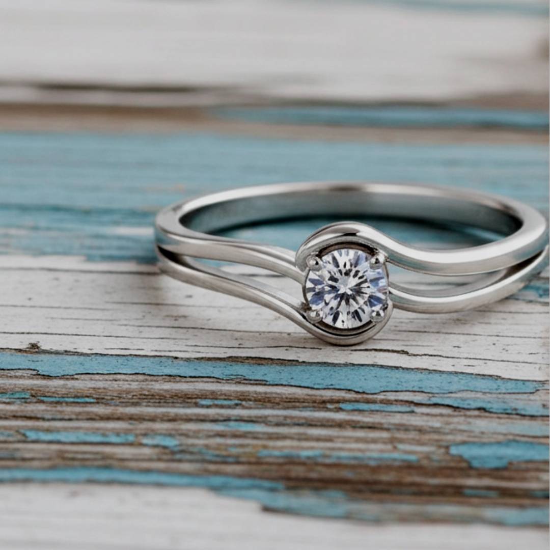 ring with a diamond on a wooden surface