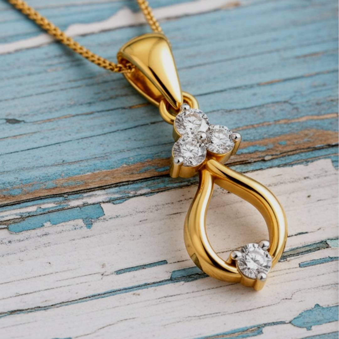 Gold pendant with diamond accents on a wooden surface