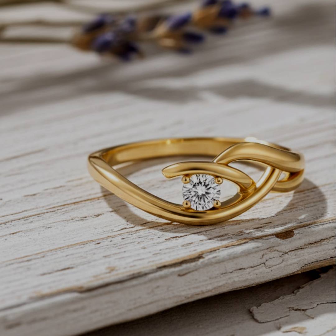 Gold ring with a diamond on a wooden surface