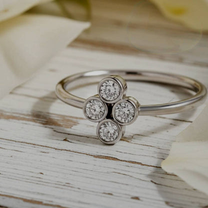  ring with diamond-like stones on a wooden surface