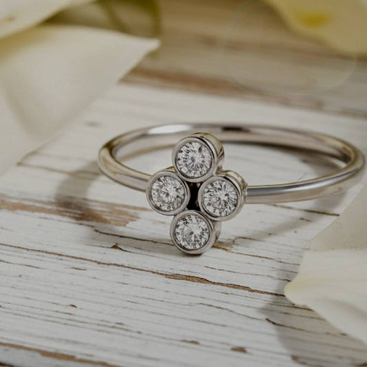  ring with diamond-like stones on a wooden surface