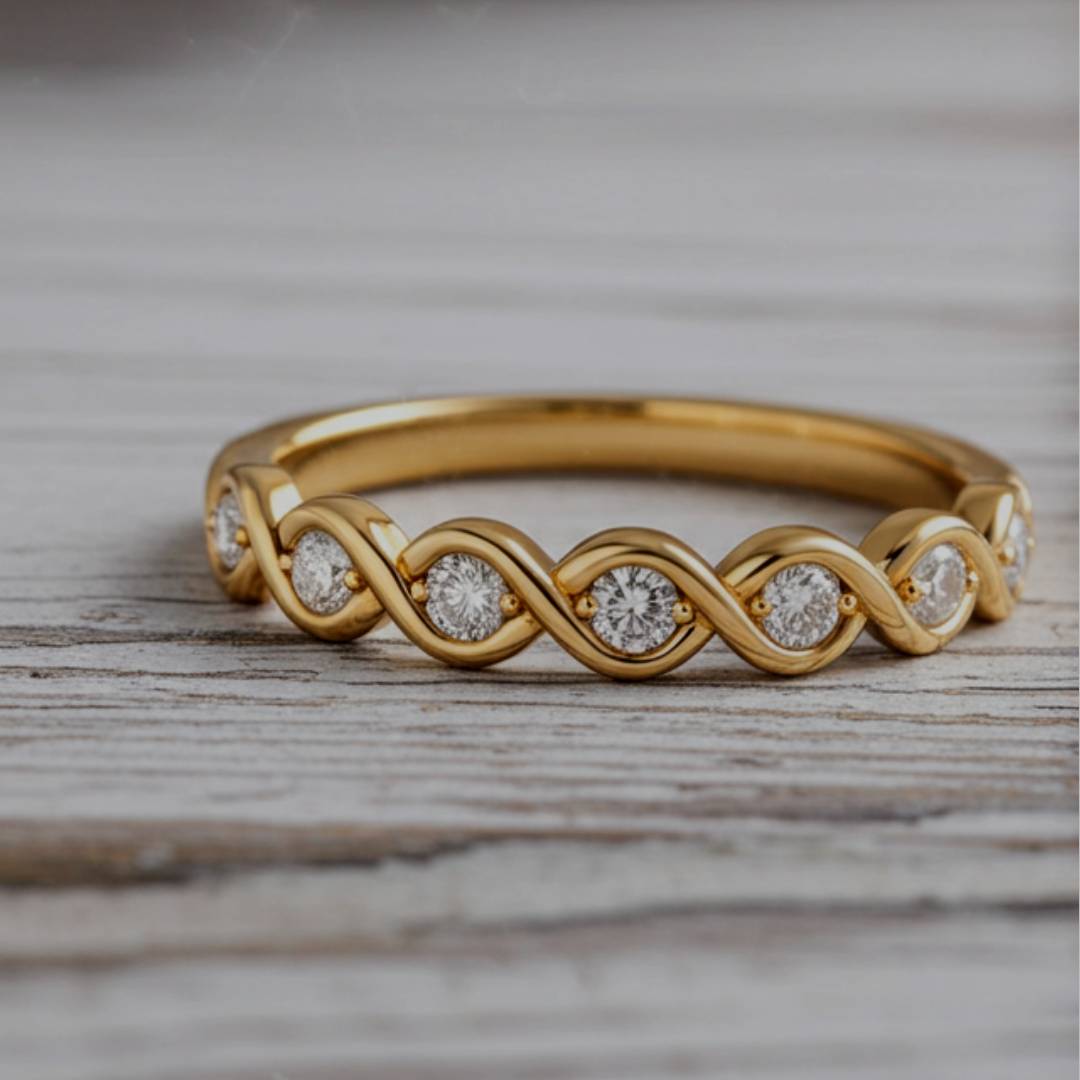 Gold ring with diamond accents on a wooden surface
