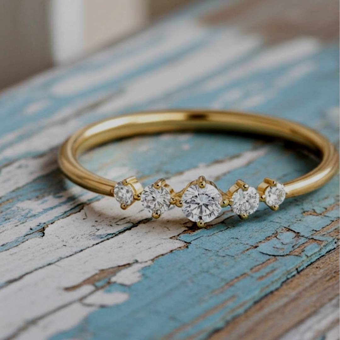 Gold ring with diamonds on a rustic wooden surface